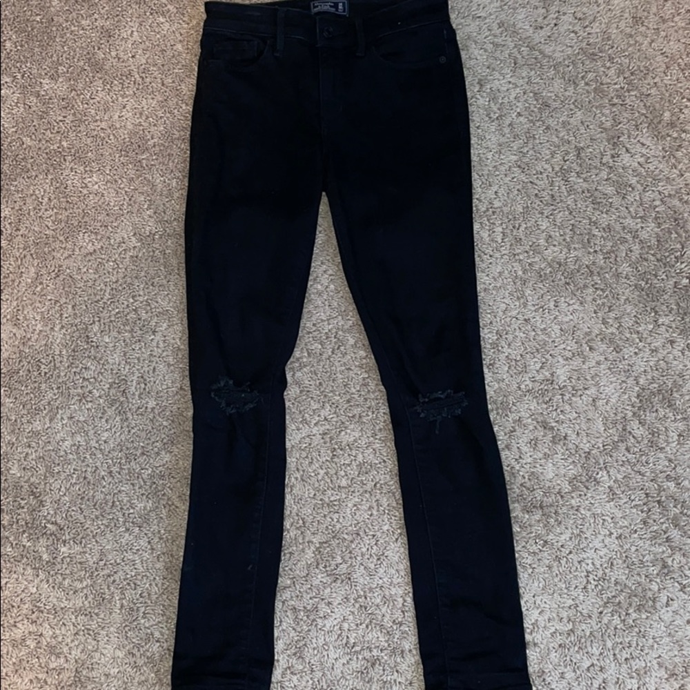Black Abercrombie and Fitch jeans with 2 rips